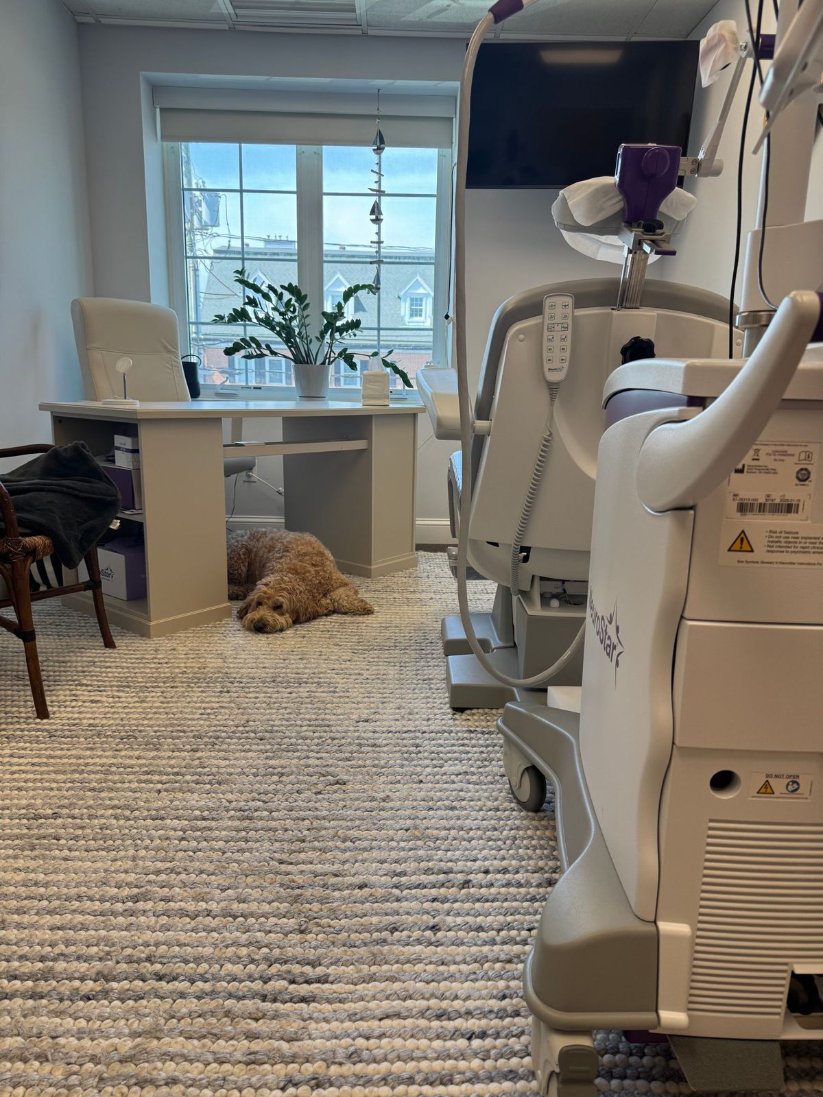 The bright, calm TMS treatment room in the Cos Cob office